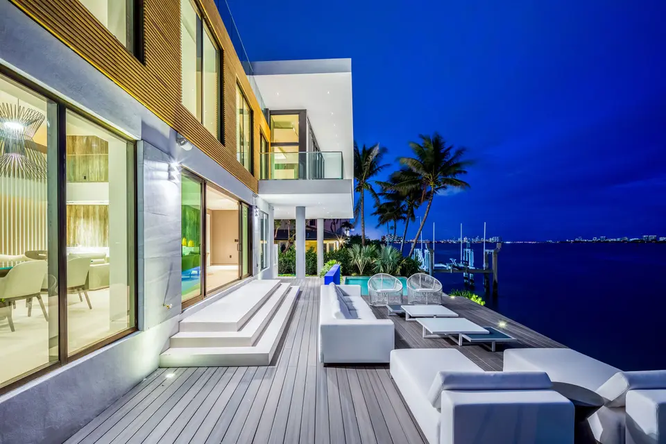 Villa Oceanic waterfront terrace at twilight
